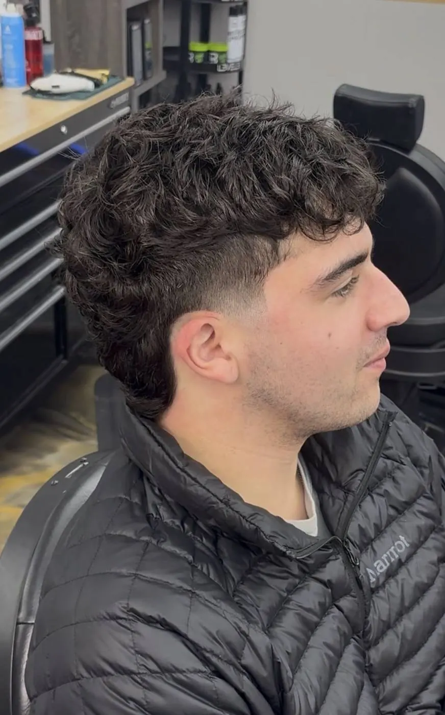 Curly fringe with a taper